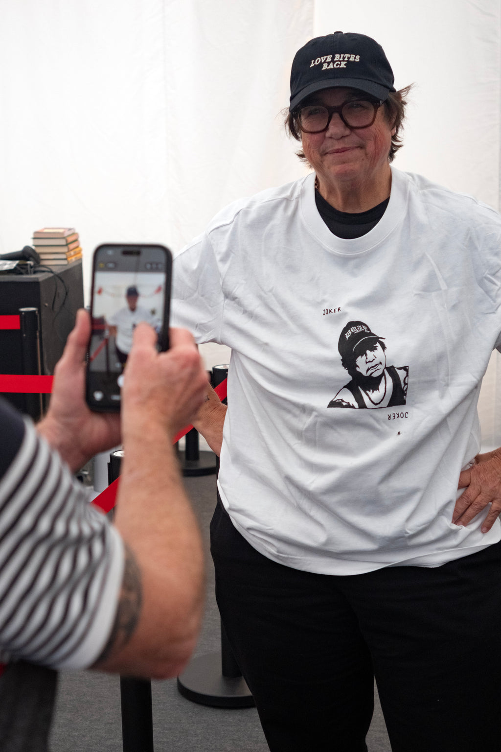 Cathy wearing her bespoke t-shirt + a Love Bites Back cap by Del LaGrace Volcano