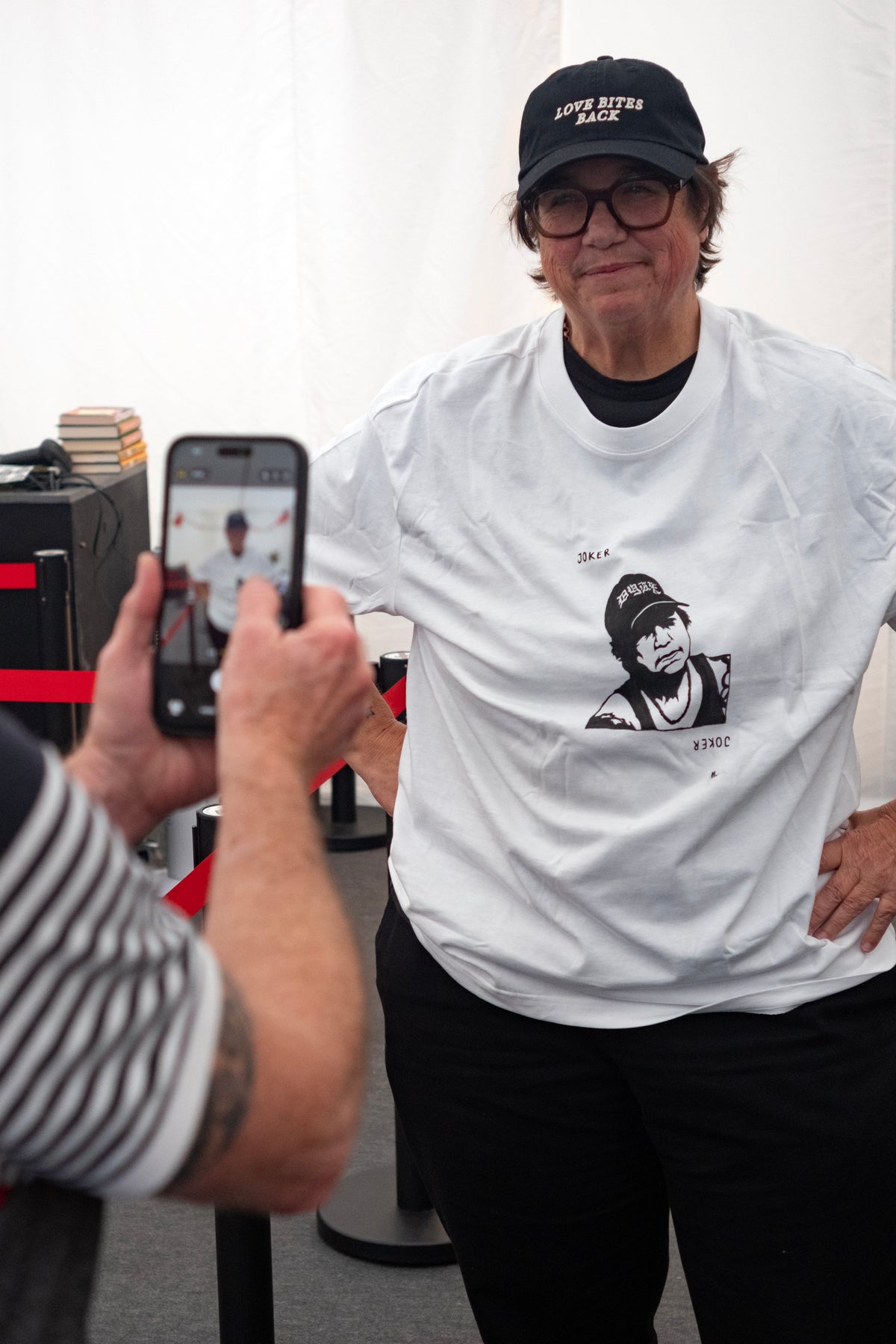 Cathy wearing her bespoke t-shirt + a Love Bites Back cap by Del LaGrace Volcano